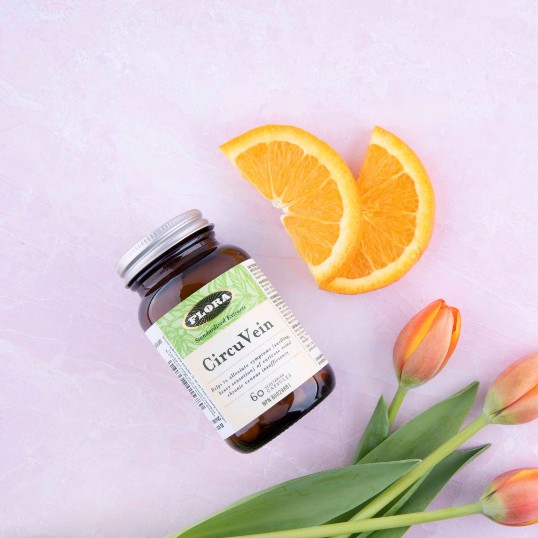 vein health supplements for swelling and appearance pictured with natural ingredients, oranges and tulips