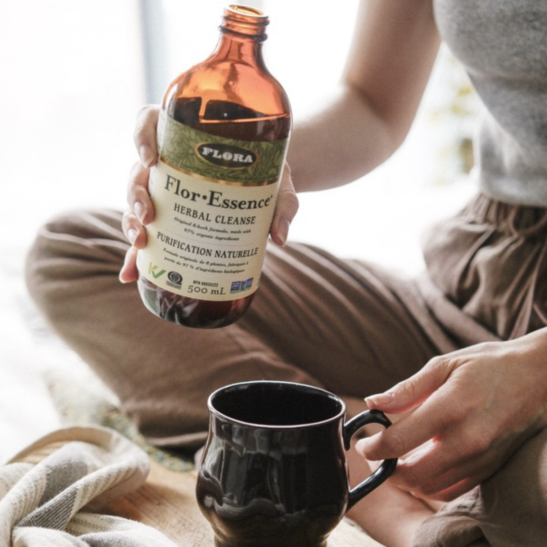 herbal cleanse formula being poured into teacup in order to help cleanse toxins from body